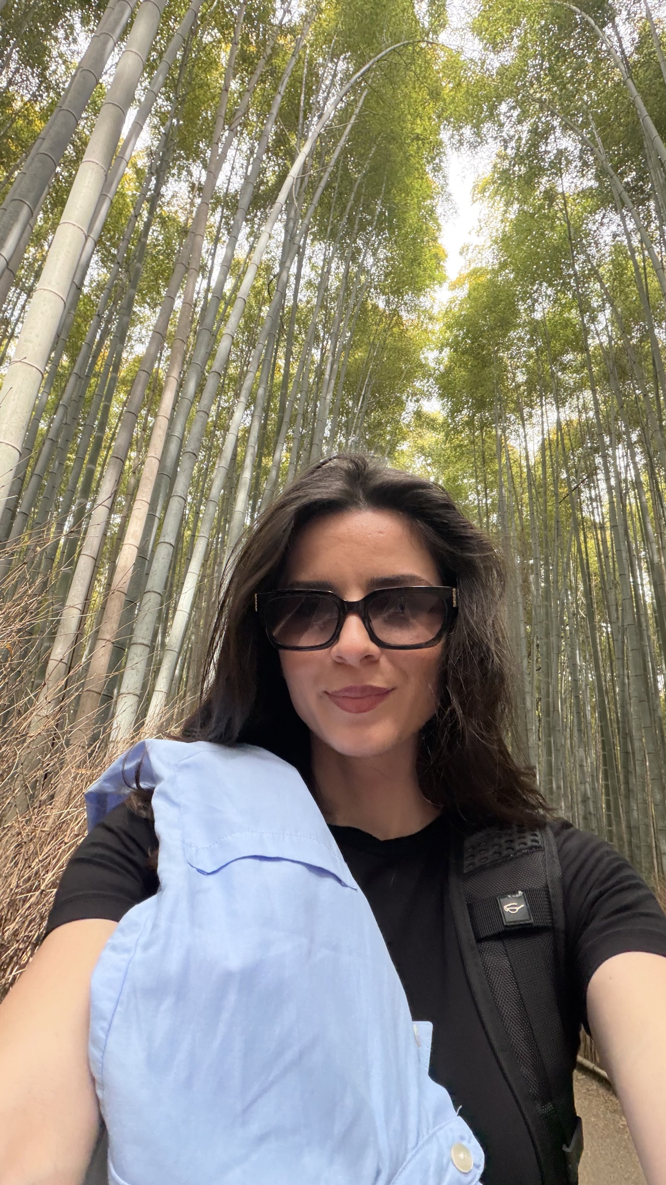 Katerina surrounded by tall bamboo trees