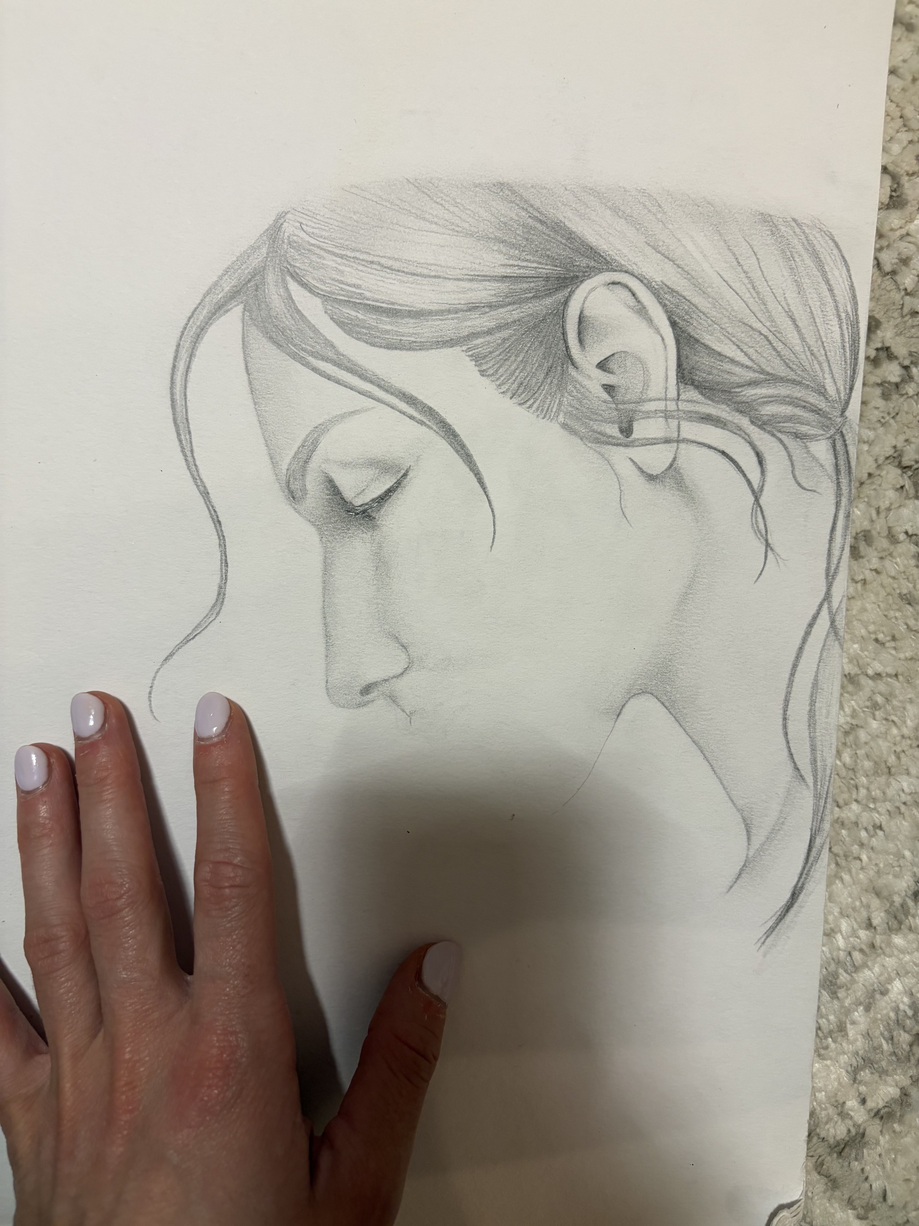 A pencil portrait sketch in progress